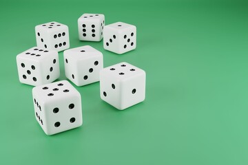 Closeup shot of white playing dice on a green background