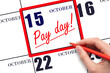 Hand writing text PAY DATE on calendar date October 15 and underline it. Payment due date
