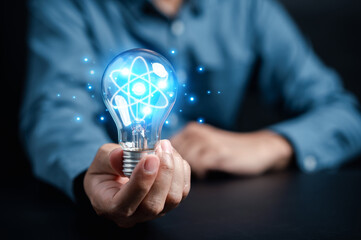 Fototapete - Man holding light bulb with learning education and graduation concept. study knowledge to creative thinking idea and problem solving solution, E-learning online education course degree certificate