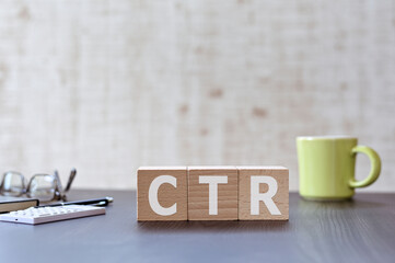 Poster - There is wood cube with the word CTR. It is an acronym for Click Through Rate an eye-catching image.