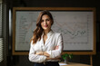 © aicandy - Portrait of a businesswoman in a boardroom, standing next to a whiteboard and pointing at a graph, generative ai