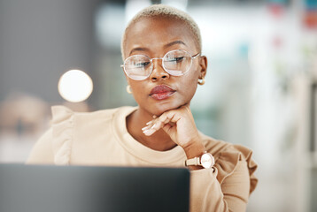 Office, laptop and black woman with glasses, thinking or reading email, online research or report. Computer, concentration and African journalist proofreading article for digital news website or blog