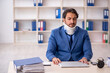 © Elnur - Young male employee after accident sitting at workplace