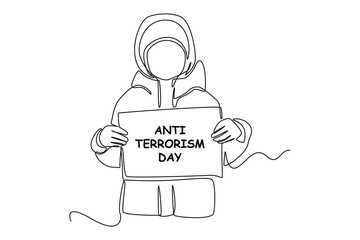 Single one-line drawing child in a thick jacket holding an anti-terrorism day paper. Anti-terrorism day concept continuous line draw design graphic vector illustration