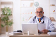 © Elnur - Old male doctor working in the clinic