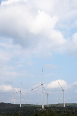 Wall Mural - Wind generator turbines at wind farm. Alternative energy concept.