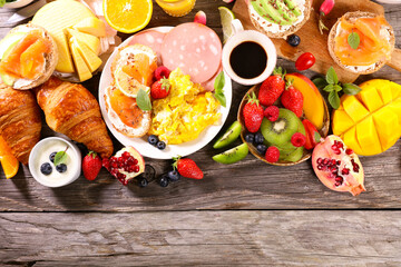 Canvas Print - healthy breakfast with egg,  toast,  croissant, fresh fruit and coffee cup