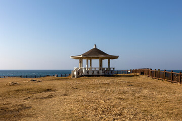 Wall Mural - Hills, octagonal pavilion and blue sky