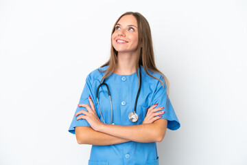 Young surgeon doctor Lithuanian woman isolated on white background looking up while smiling