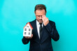 © luismolinero - Real estate middle age agent man isolated on blue background with tired and sick expression