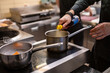 © pavel siamionov - Chef hands cooking sauce in the restaurant kitchen