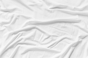 White wrinkled fabic texture rippled surface,Close up unmade bed sheet in the bedroom after night sleep Soft focus