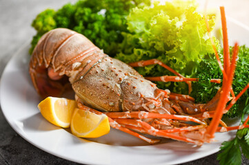 Wall Mural - spiny lobster food on plate, fresh lobster or rock lobster seafood with herb and spices lemon coriander parsley lettuce salad, lobster for cooking food and seafood sauce