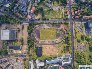 Wall Mural - VILNIUS, LITHUANIA - JULY 11, 2016: Flying over the Vilnius and Stadium of Zalgiris. Cityscape in Background