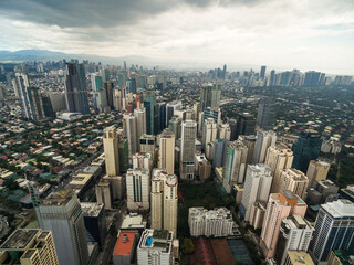 Poster - Manila Cityscape, Makati City with Business Buildings and Cloudy Sky. Philippines. Skyscrapers in Background.