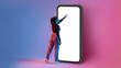 Full length shot of black lady touching screen of huge smartphone in neon light, mockup for app or website design