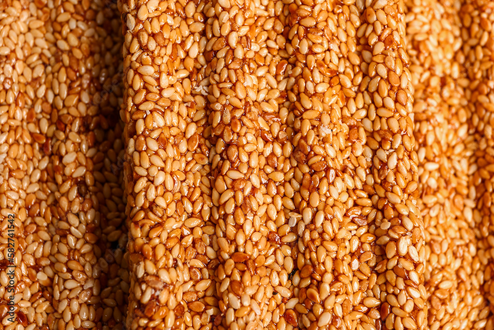 Tasty sesame kozinaki as background, closeup