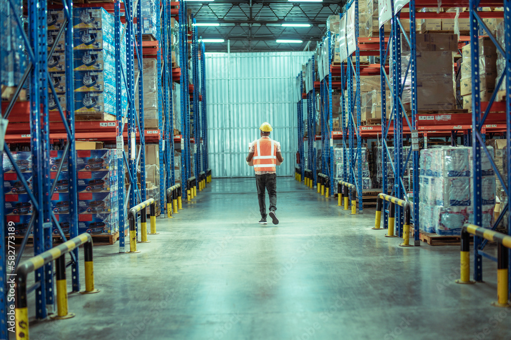 African American male warehouse worker hold cardboard box packaging in ...