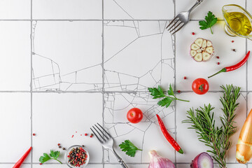 Wall Mural - Cooking food background made of seasoning, spices, herbs, sauces and vegetables on white tile kitchen table