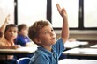 Young boy student raising hand in a classroom, eager to learn, participation, education, school, confidence, generative ai