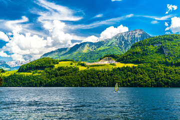 Wall Mural - Windsurfers in the lake with mountains, Alpnachstadt, Alpnach Obwalden Switzerland