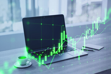 Aufkleber - Close up of laptop, coffee cup and notepad with growing green candlestick chart on blurry desktop with window and city view background. Forex, trade and finance concept. Double exposure.