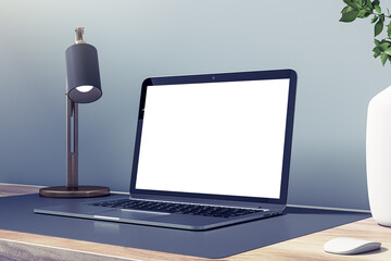 Poster - Close up of empty white laptop computer on wooden desk with decorative vase and plant, lamp and mock up place on concrete wall background. Designer workspace concept. 3D Rendering.