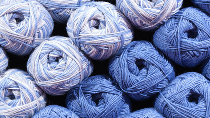 Poster - Balls of blue wool, assortment of yarn on display in the store. Sale of yarn for knitting beautiful wool sweaters.