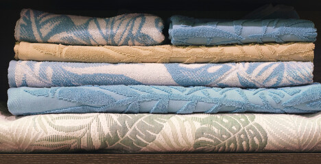 Leinwandbilder - Colorful folded towels stack closeup picture, hotel service concept background