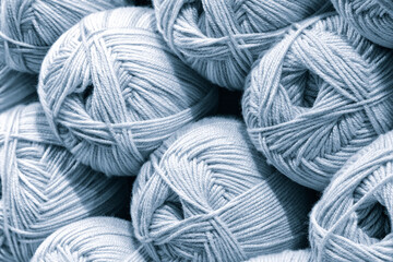 Poster - Balls of blue wool, assortment of yarn on display in the store. Sale of yarn for knitting beautiful wool sweaters.