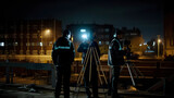 Fototapeta Londyn - Construction Surveyors working at night on a construction site. AI Generated