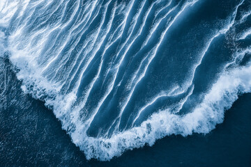 spectacular aerial top view background photo of ocean sea water white wave splashing in the deep sea