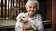 Attractive Happy Elderly Woman on Her Porch Holding Her Maltese Puppy - Generative AI.