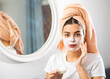 © JackF - Young woman taking care of her body makes a cosmetic face mask at home