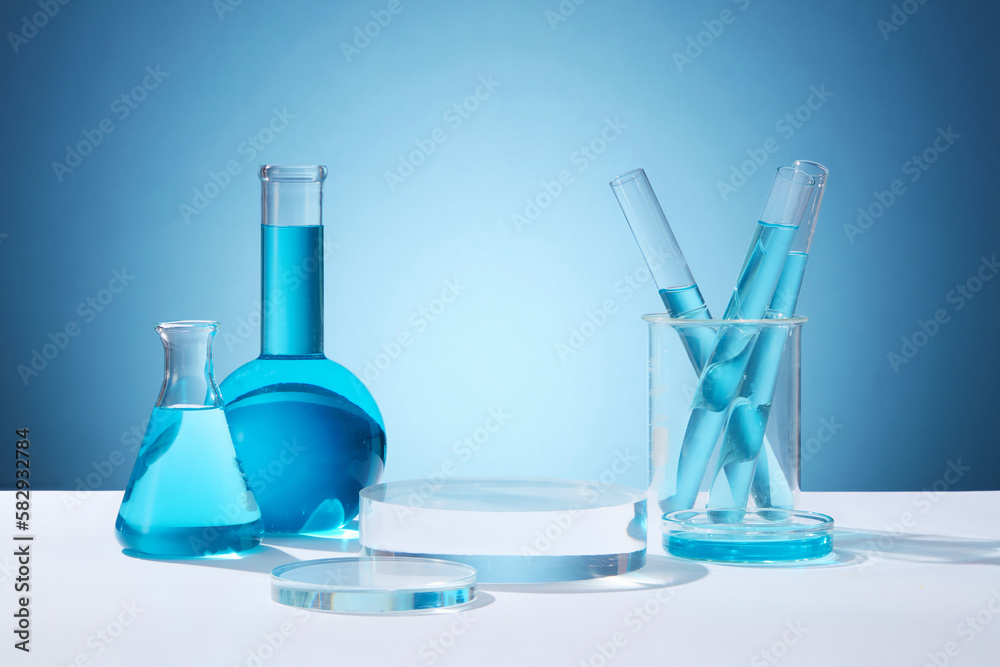 Laboratory Transparency Front view of circle transparent podium and laboratory glassware filled ...
