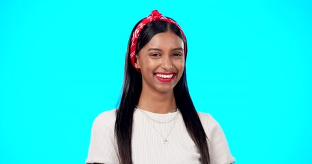 Sticker - Happy woman, face and wink on blue background, laughing and flirting in studio. Portrait of indian female, model and winking with smile, fun mood and happiness of young gen z fashion, style and joy