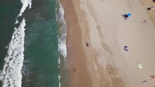An Aerial Drone Flies Over Top Of The Beach In Sayulita Mexico With Some People On The Sandy Beach Below