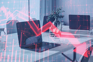Poster - Close up of laptop on coworking office desktop with red candlestick arrow going down on blurry background with window and city view. Economic recession and crisis concept. Double exposure.
