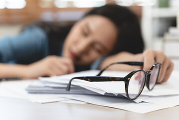 employee fall asleep on the desk after overwork last night.