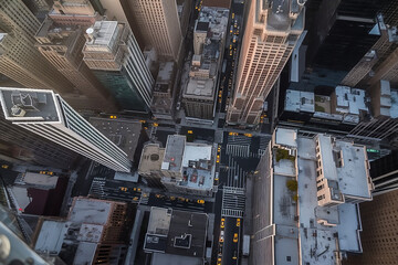  Bird's eye view of city looking down at people and yellow taxi cabs going down  Avenue. Created using generative AI tools.