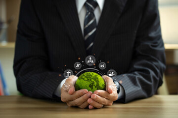 esg environmental social governance business strategy investing concept. businessman holding green w