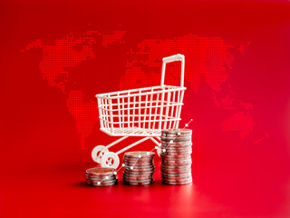 Wall Mural - Online shopping sale profit, sales increase, business marketing, inflation concepts. Growth line graph on coin stack as a step near white shopping cart trolley on digital world map, red background.