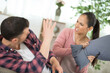© auremar - man and angry woman having pillow fight