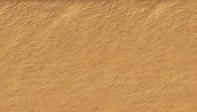 A Background Featuring Fine Brown Sand With A Textured And Sandy Feel, Generative AI