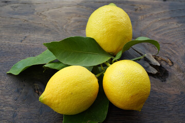 Poster - lemons on a wooden background