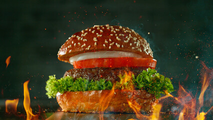 Wall Mural - Tasty beef burger on black stone table, close-up