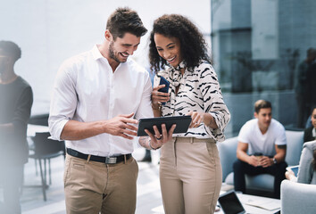 Poster - Making networking more efficient with cutting edge tech. a young businessman and businesswoman using a digital tablet at a conference.