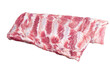 Rack of raw pork spare ribs on butcher table.  Isolated, transparent background.