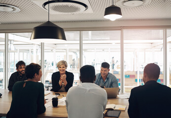 Poster - The ideas are flowing. a group of business colleagues sitting around a table in the boardroom during a meeting.