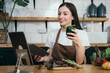 © NINENII - Woman preparing healthy food in her kitchen.